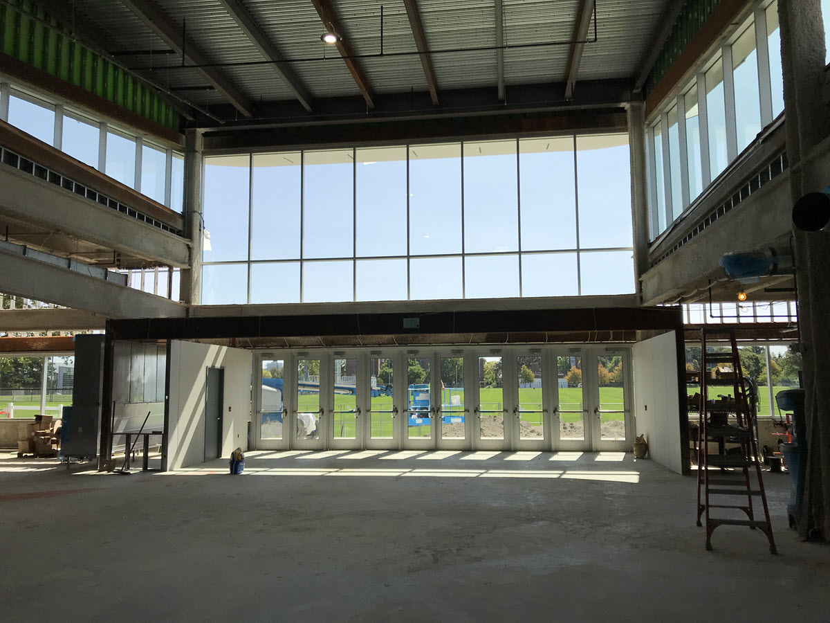 Interior shot of addition looking south towards Munn Field, showing new exterior door bank