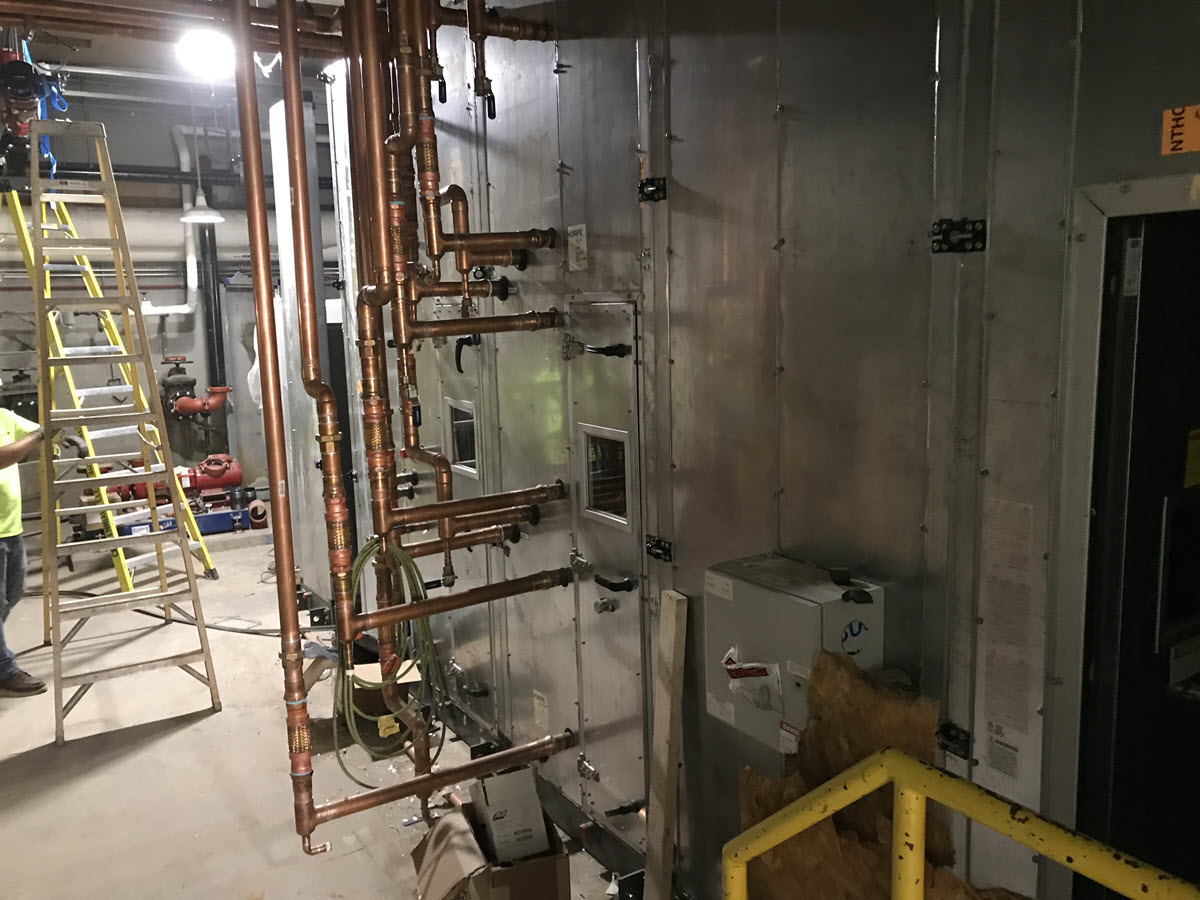 Photo of ground level new air handling unit which replaces two smaller units that were original to the building's construction