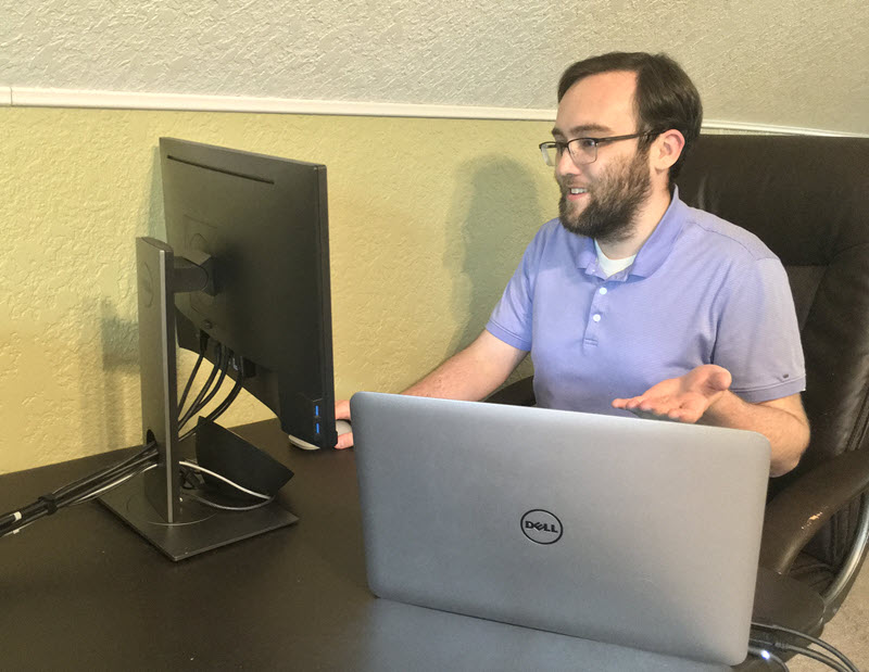 Allen Scheck, IPF information technologist, assisting a computer user remotely from his home.