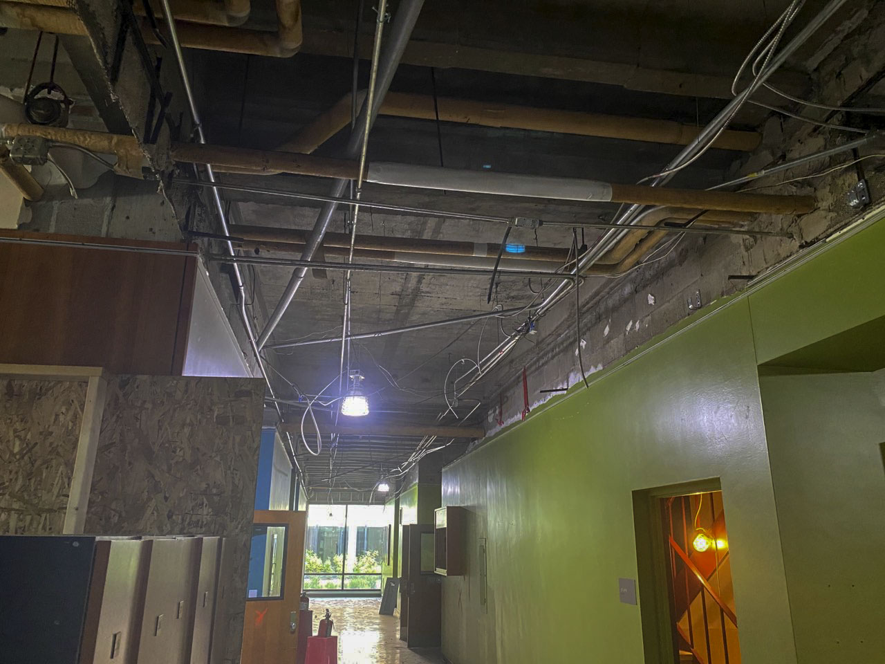 Photo of interior ceiling demolition work in Eppley Center fourth floor