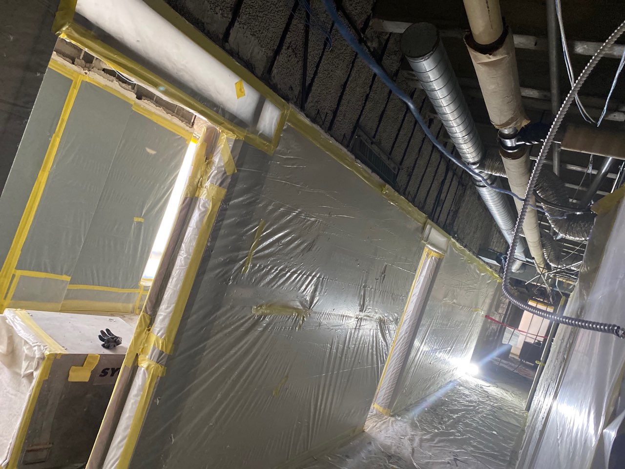 Photo of interior ceiling demolition work in Eppley Center fourth floor