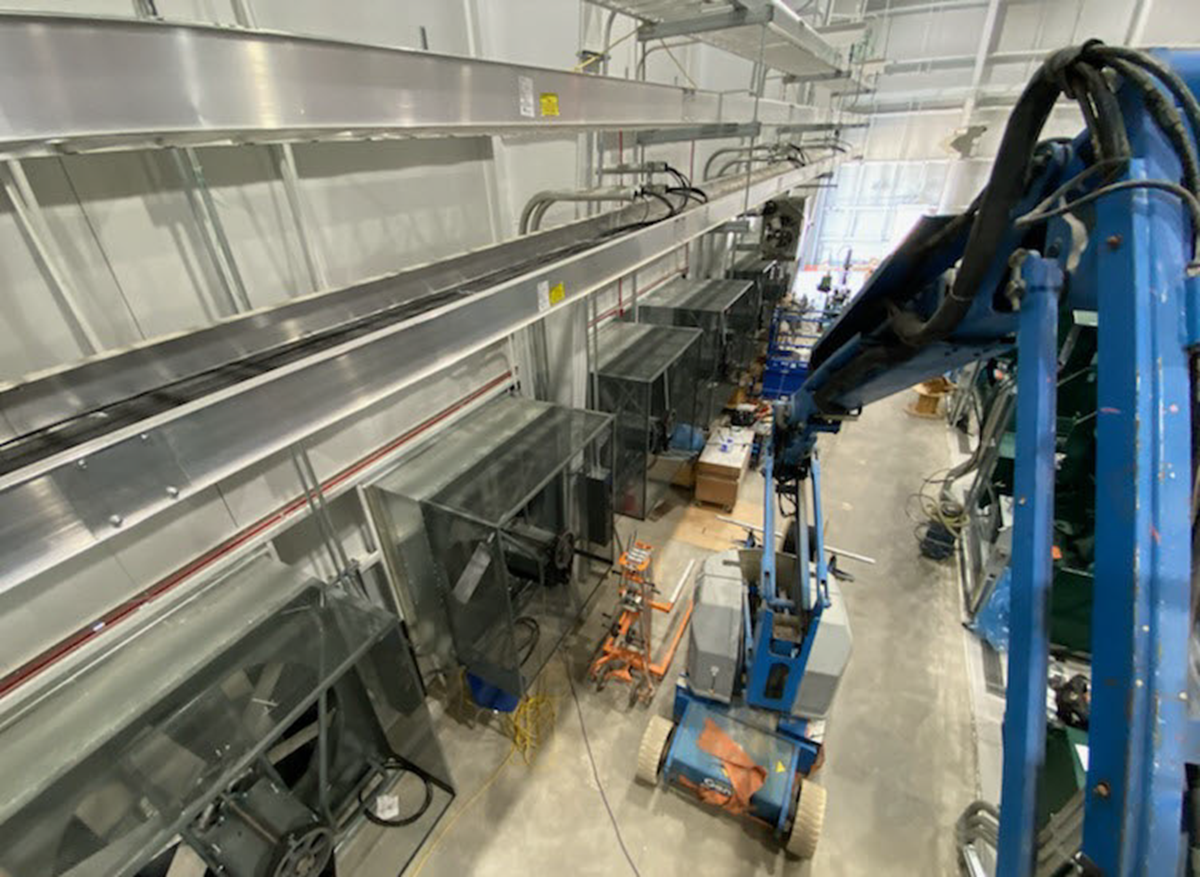 Interior photo of RICE facility showing lift in operation