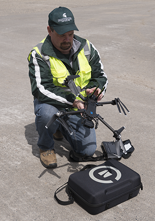 IPF drone Jeff West prepares to launch the survey drone