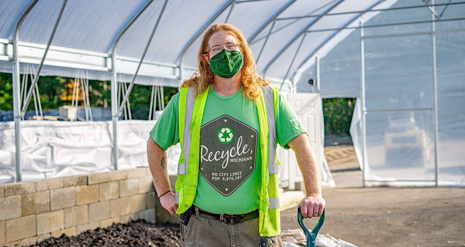 Portrait of Sean Barton, SSRC employee, standing inside hoop house