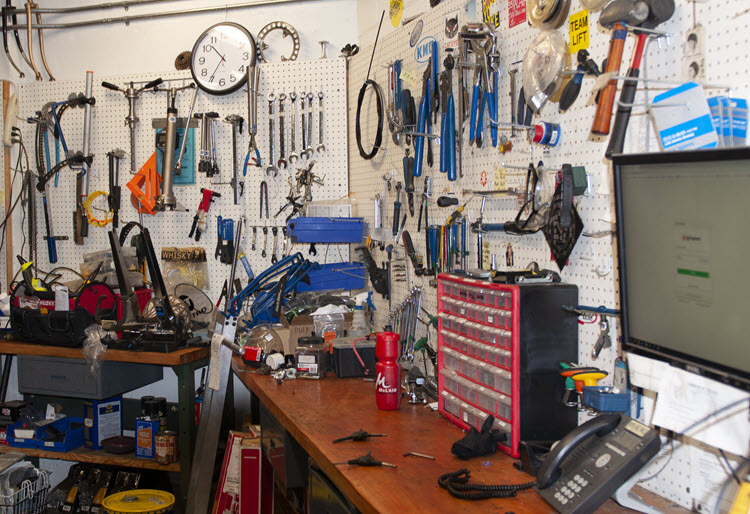 Photo of repair shop with tools on walls
