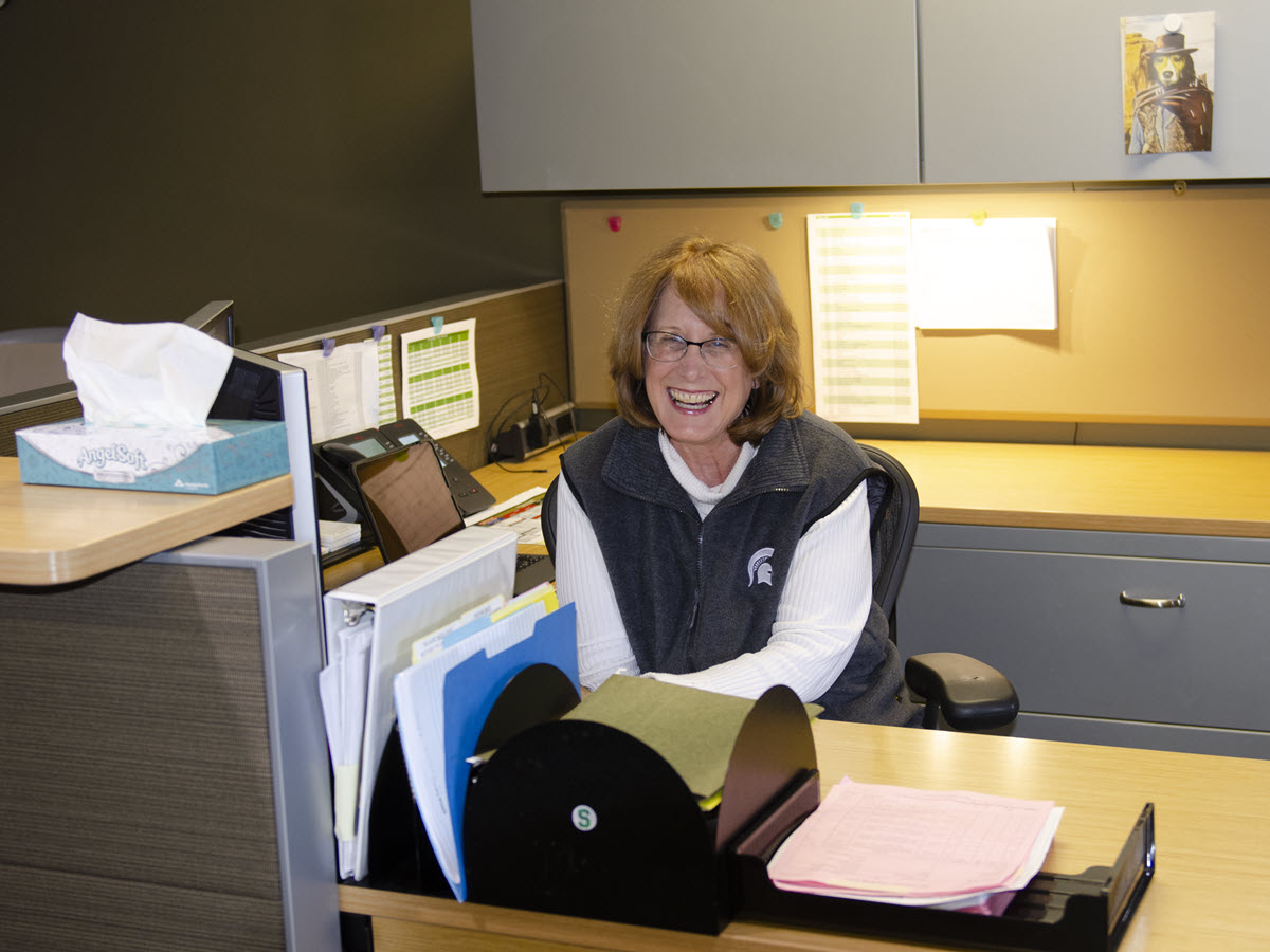 Deb North at her desk, prior to the COVID outbread