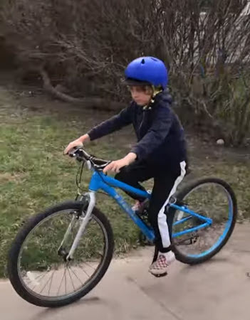 child riding bicycle