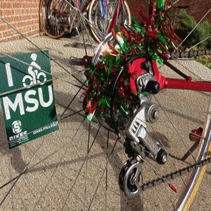 Photo of holiday decorated bicycle at the MSU Bikes Service Center
