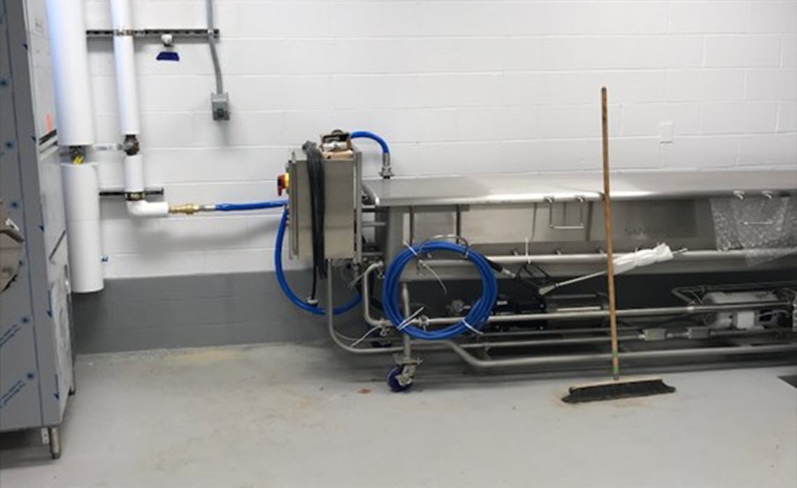 Equipment Wash Room showing dishwasher and clean-out-of-place (COP) tank which can be easily disconnected and moved