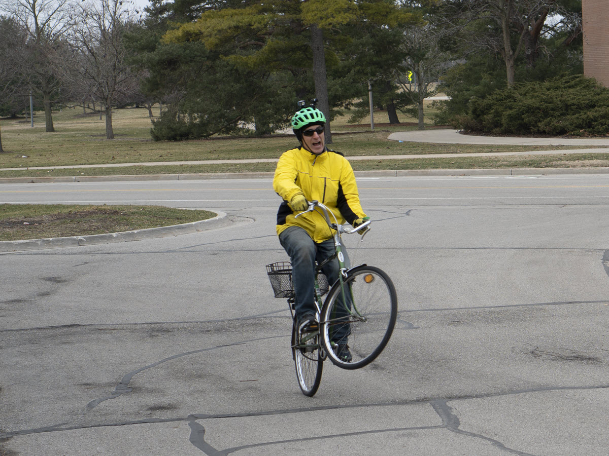 Photo of Tim Potter doing "wheelies" on a bicycle