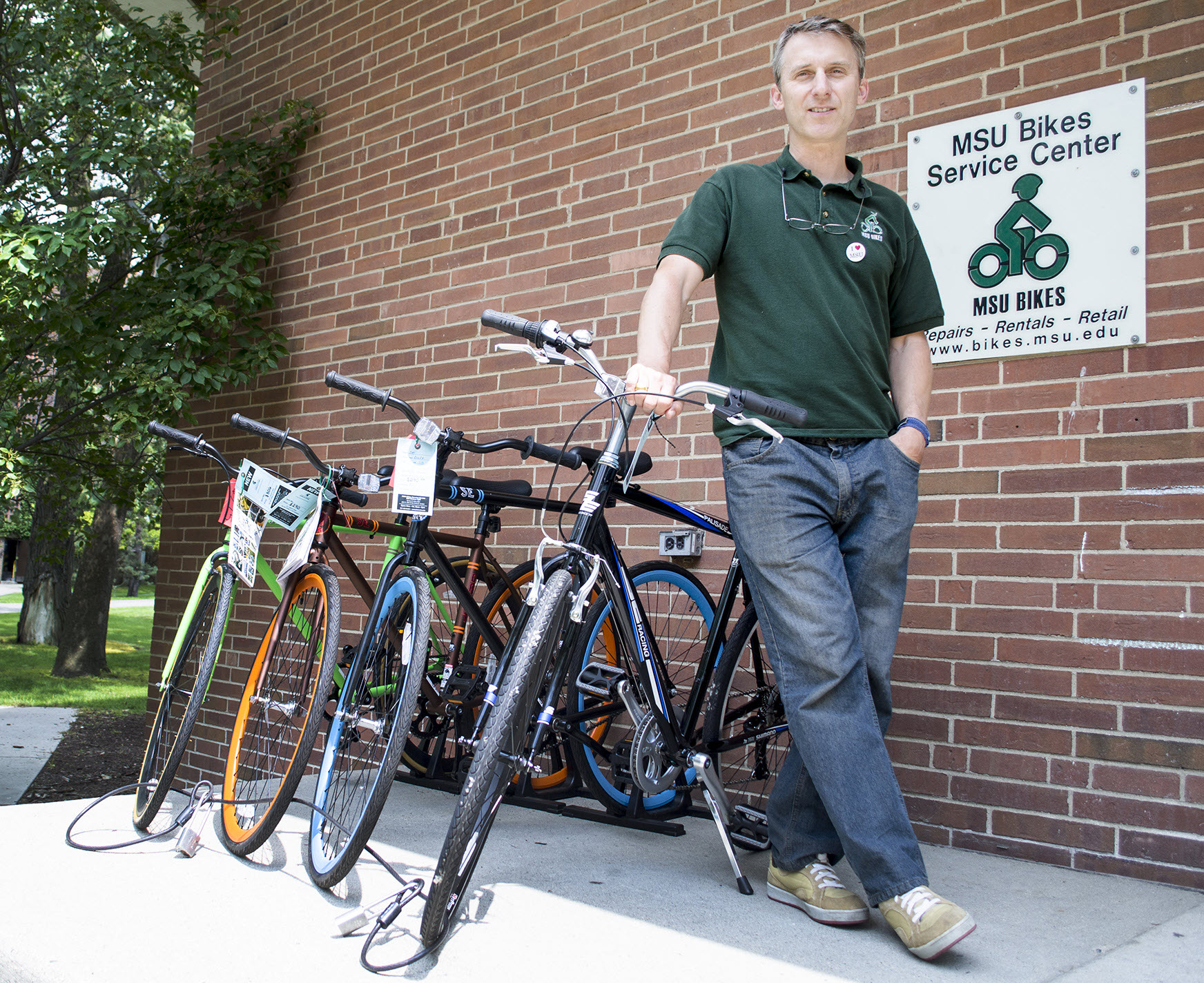Tim Potter standing in front of the MSU Bikes Service Center