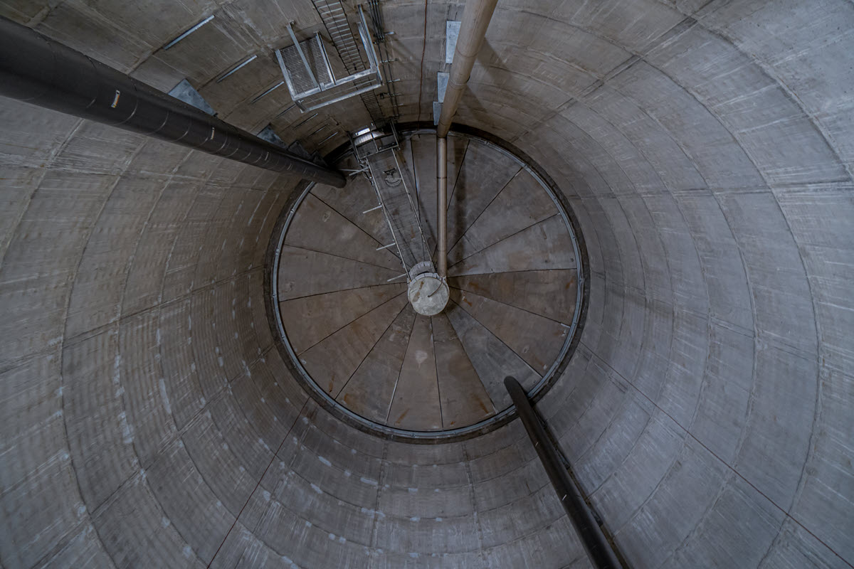 View from interior of storage tower base looking up at bottom of 2 million gallon tank