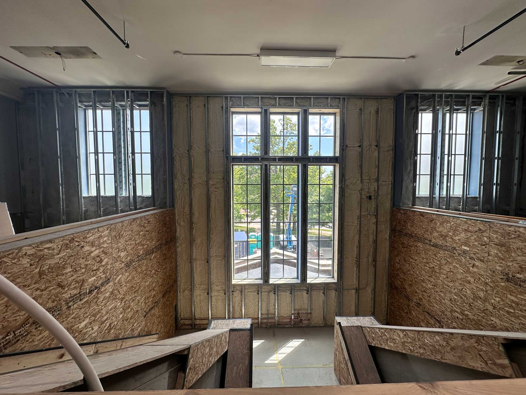 interior of museum renovations with plywood unfinished interior walls