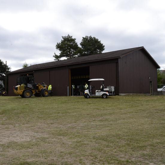 Photo of old Fisheries boat storage building being cleaned out in preparation for its use as a large equipment storage space for west campus landscape services substation