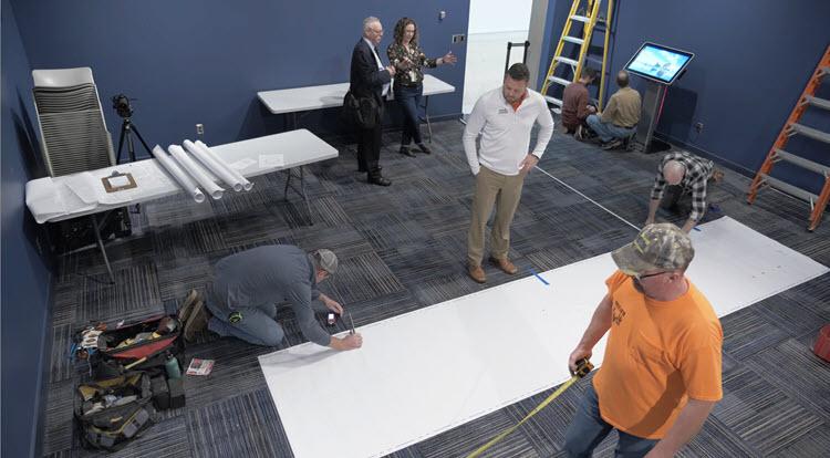 Ian O'Brien working with IPF and MSU Museum crews to fabricate globe