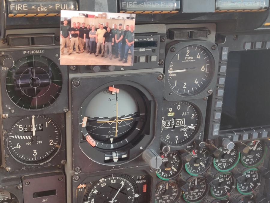 Photo of Eric Strouse's crew taped inside the cockpit of a fighter jet