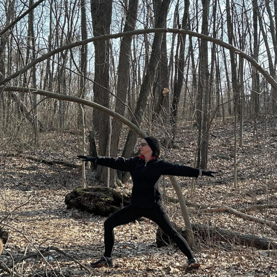 Rita leading yoga in the November woods.