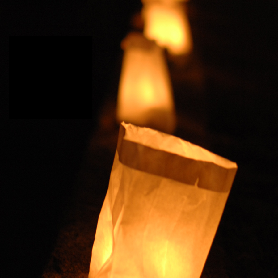 Luminaries line the ground.