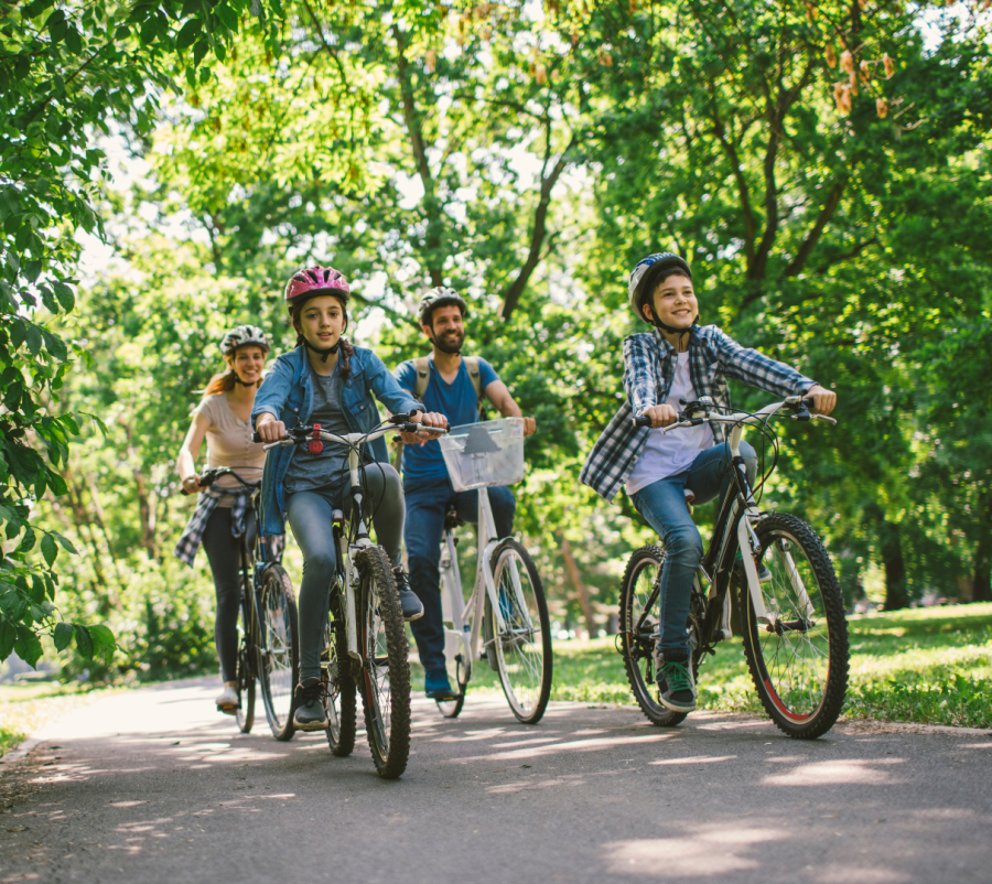 A family enjoys pedaling through the scenic Gardens.