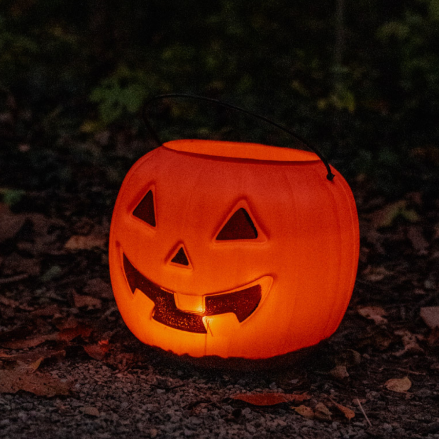 Illuminated pumpkin along the trail.