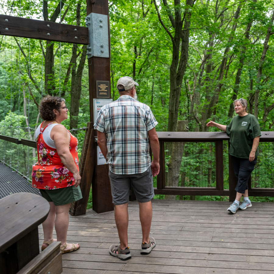 A Sky Walk volunteer greeting guests at the start of the Sky Walk.
