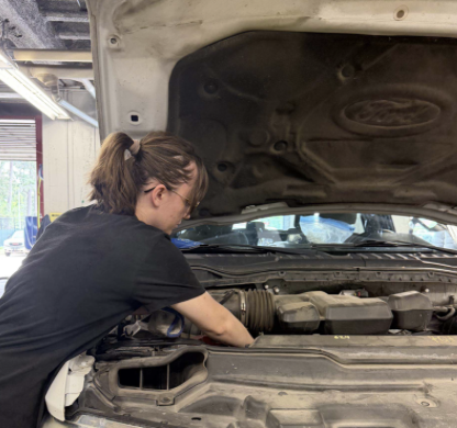 Service Garage employee working on a car