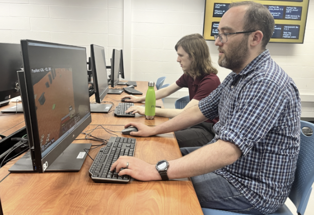 Allen and Joe working at a computer