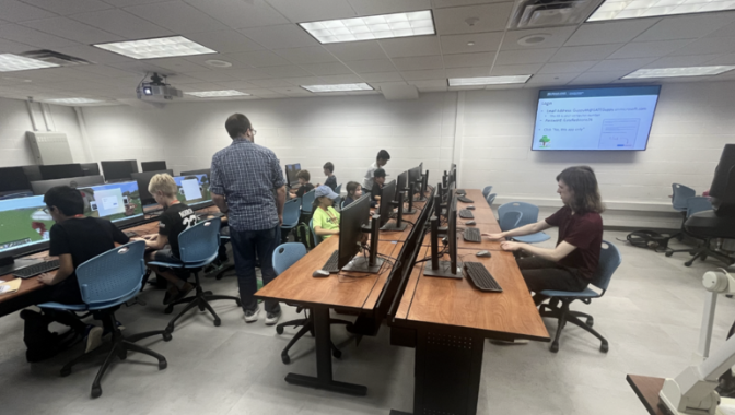 Wideshot of students working at computers in a classroom