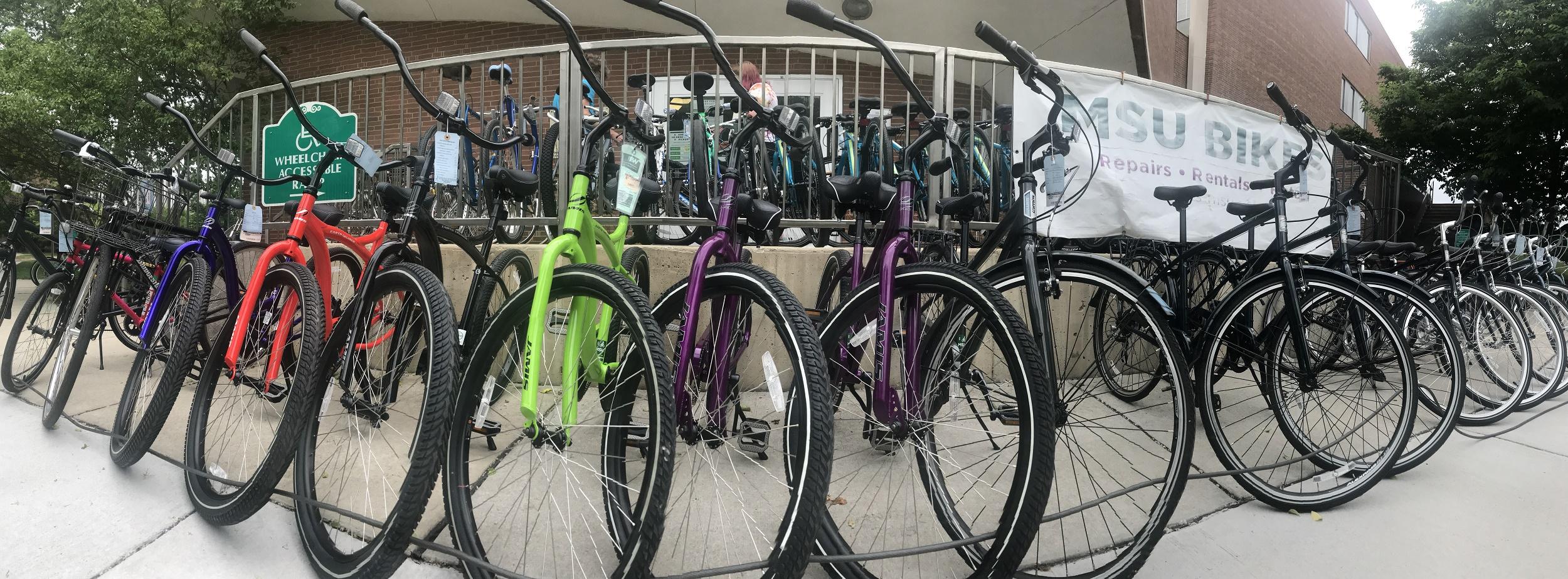Bikes lined up outside of the MSU Bikes Service Center on MSU campus