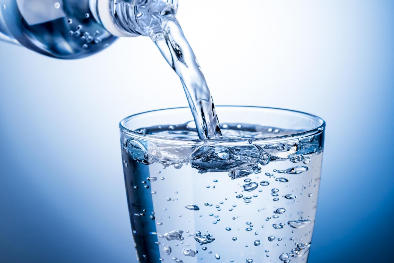 Clear water pouring into a glass.