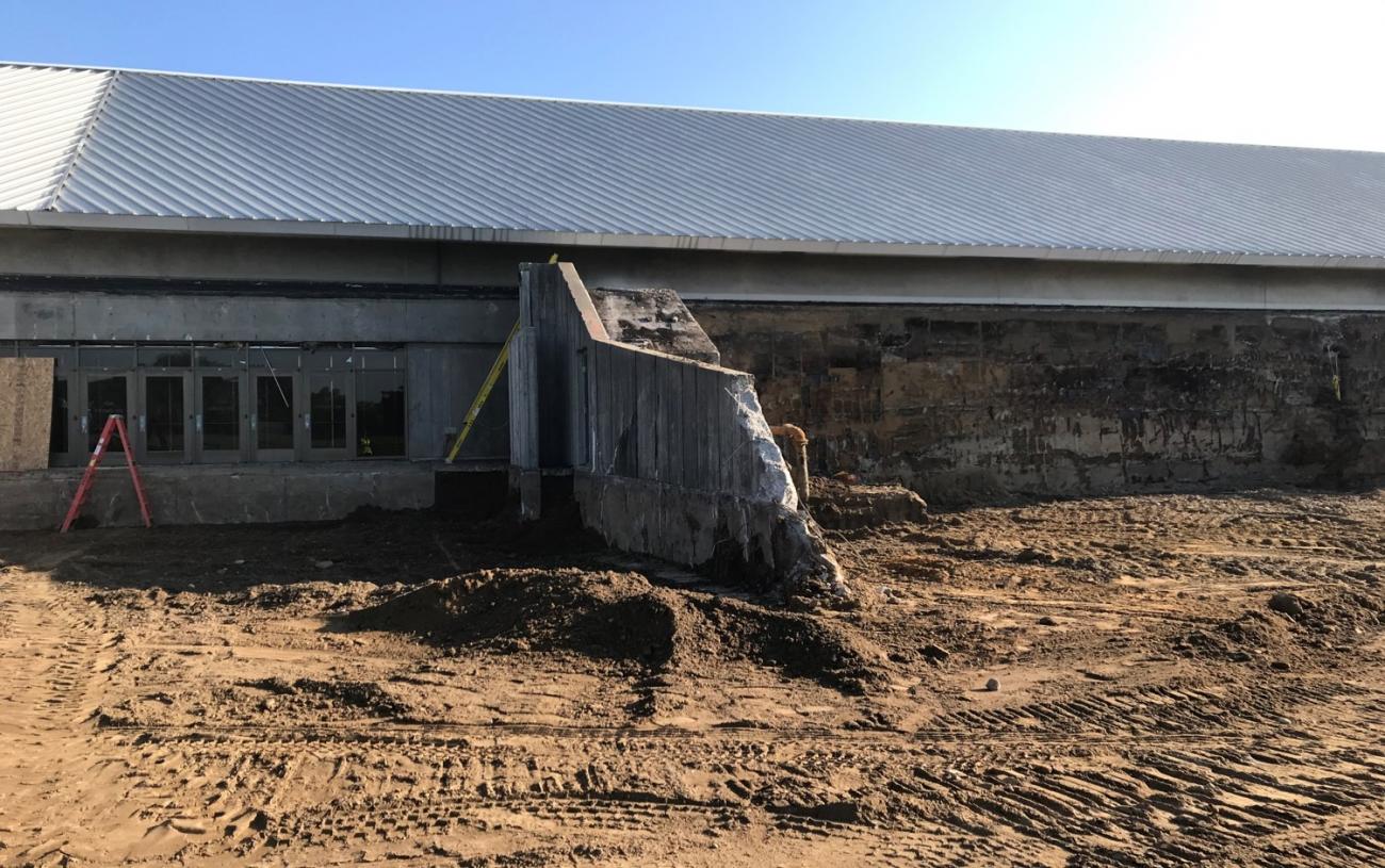 Demolition of existing entrance canopy complete. Wing wall and stair demolition in progress.