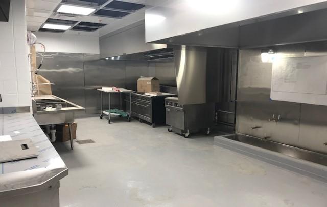 Pilot Kitchen with installed Ansul grease hood, stove and fryer