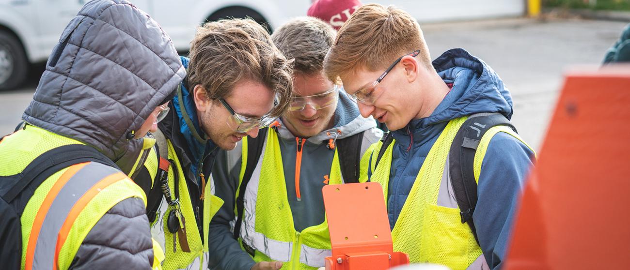 MSU College of Engineering Students Looking at a Phone