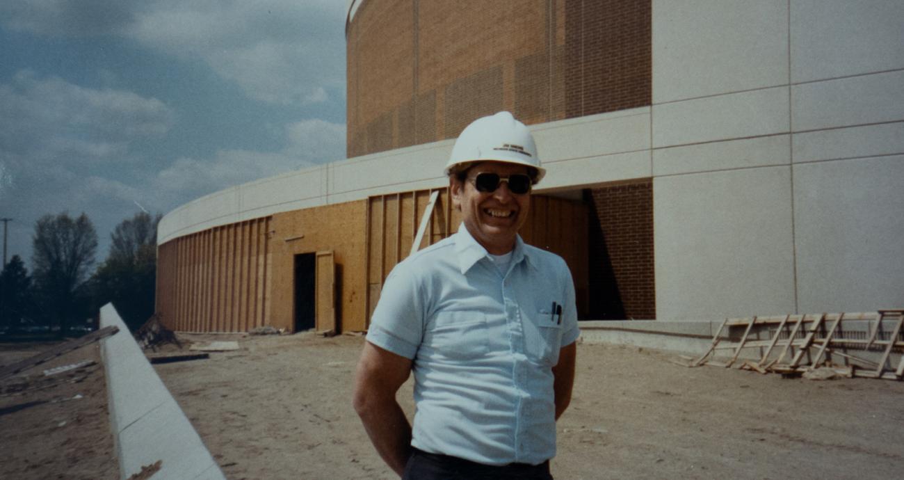 Photo of employee standing in the Breslin Center construction zone