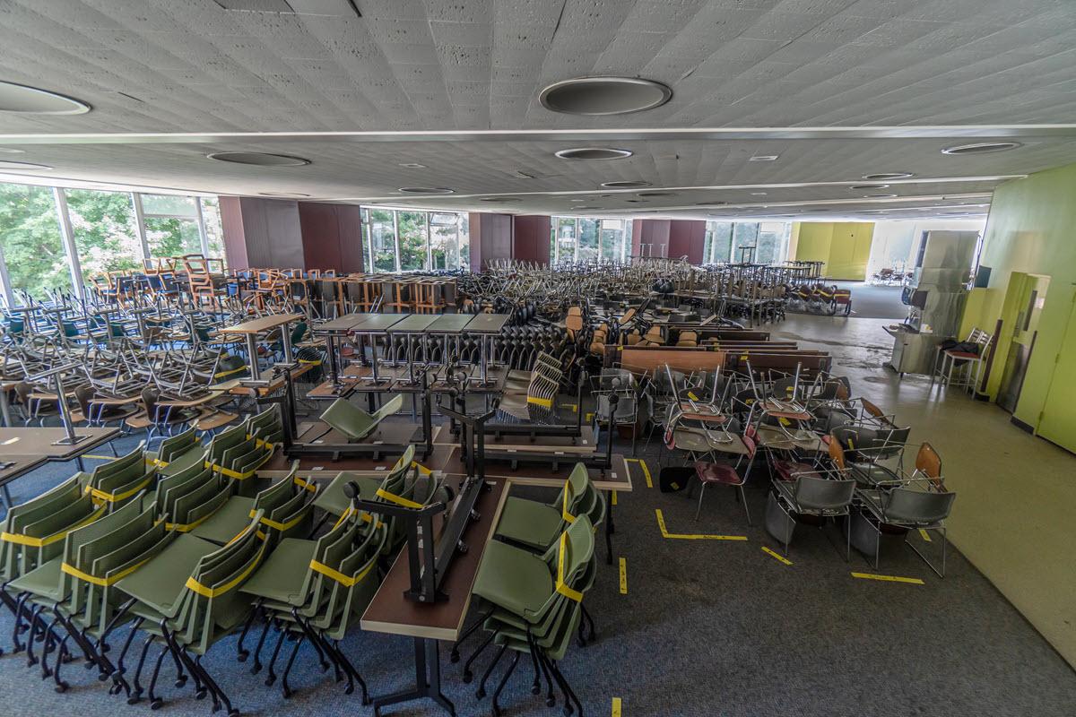 McDonel Hall cafe filled with classroom seats, tables and desks 