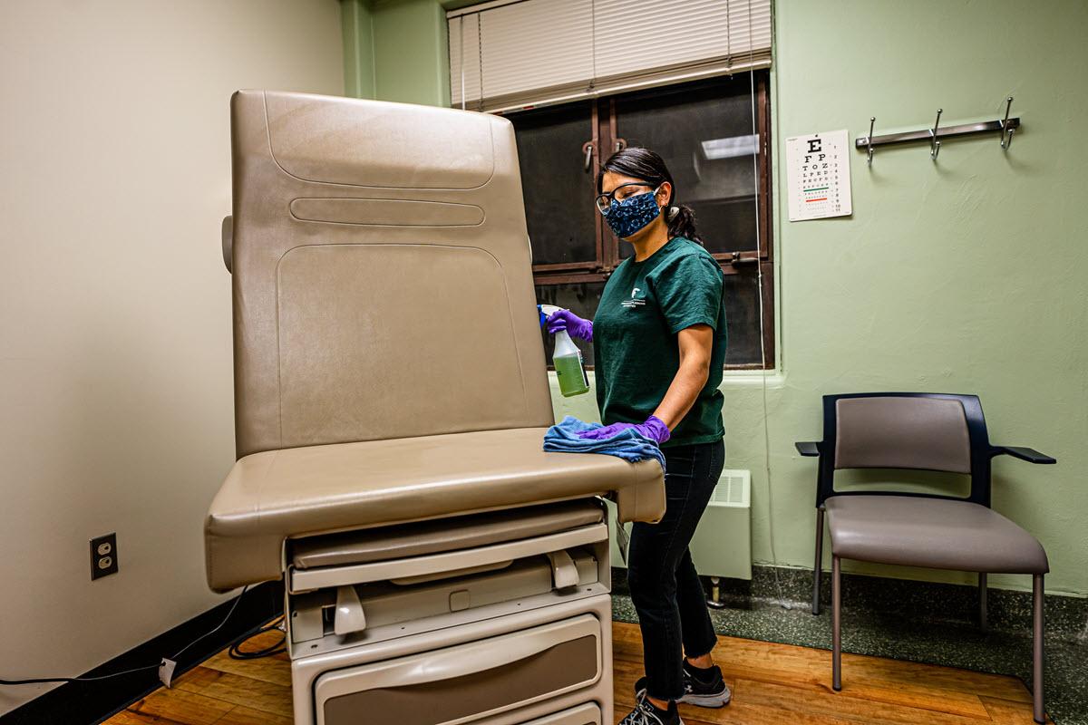 IPF custodian Maria Lopez helps keep Olin Health Center clean and safe.