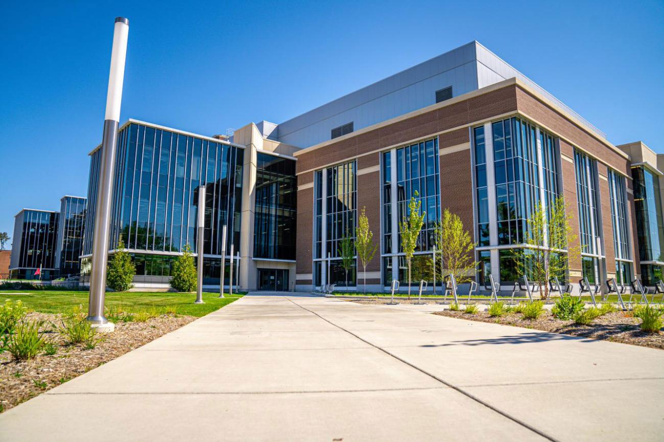 Exterior of the STEM teaching and learning facility with a bright blue sky