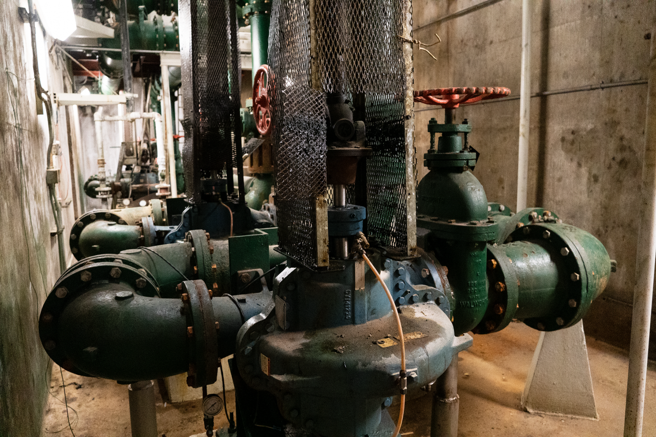 Photo of one of the electric pumps in blue that maintained water pressure on campus prior to the reservoir being decommissioned 