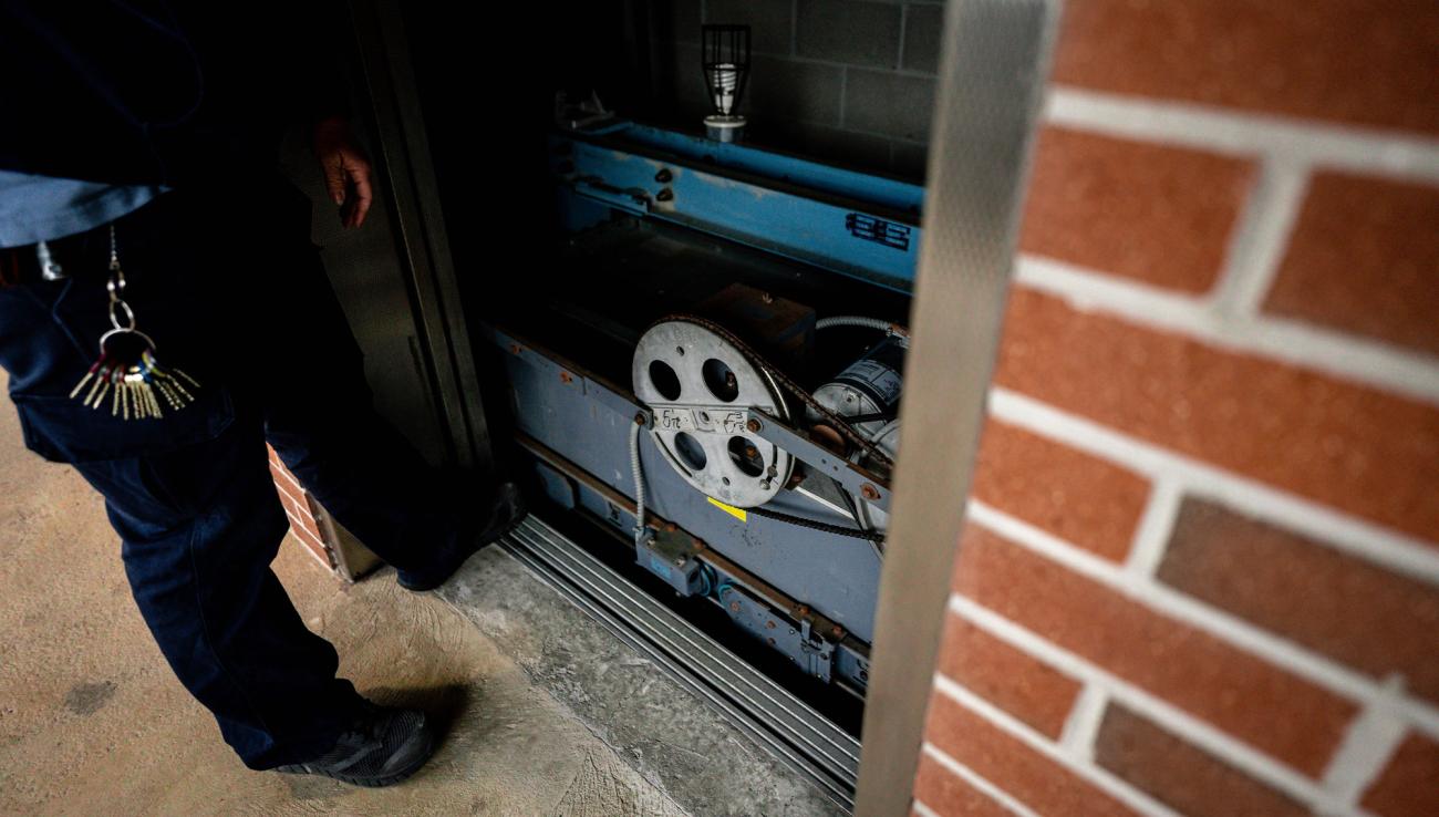 IPF worker Melissa Peek at work doing elevator maintenance