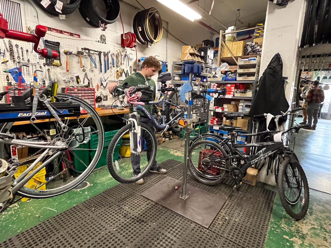 Large workshop with bicycles being repaired