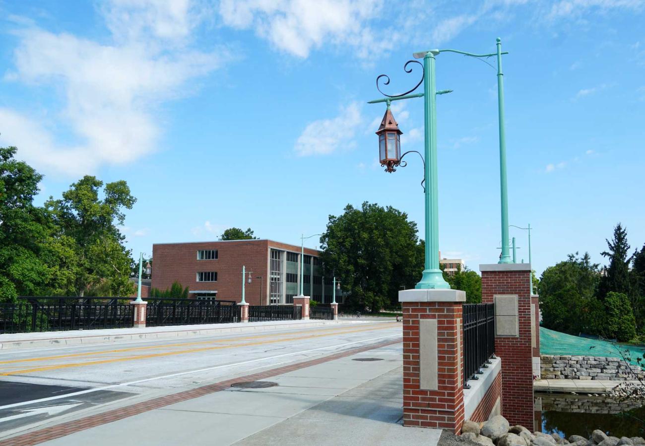 Newly completed Farm Lane Bridge with brick-mounted brass lanternn light poles