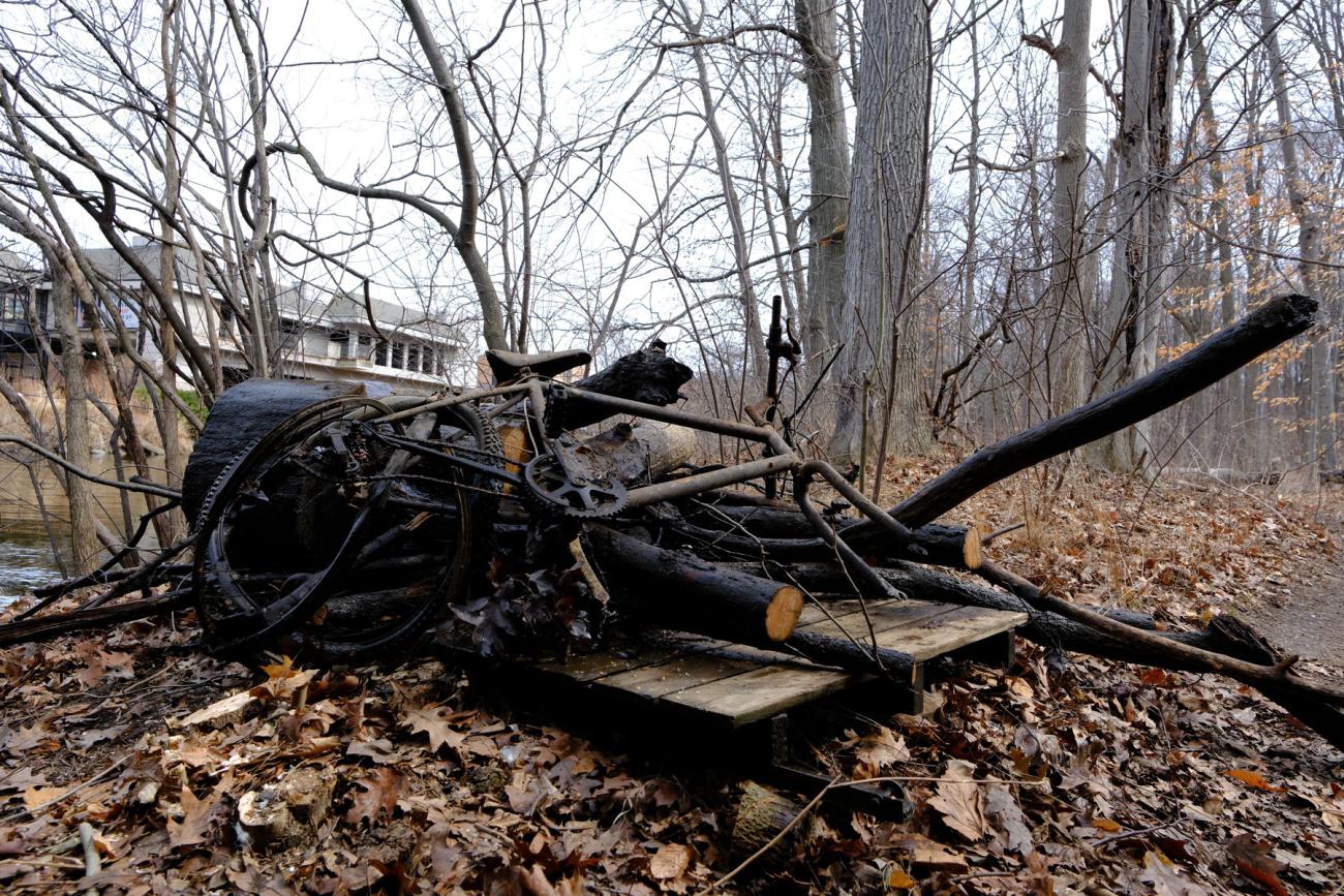 A pile of debris on the banks of the Red Cedar River.