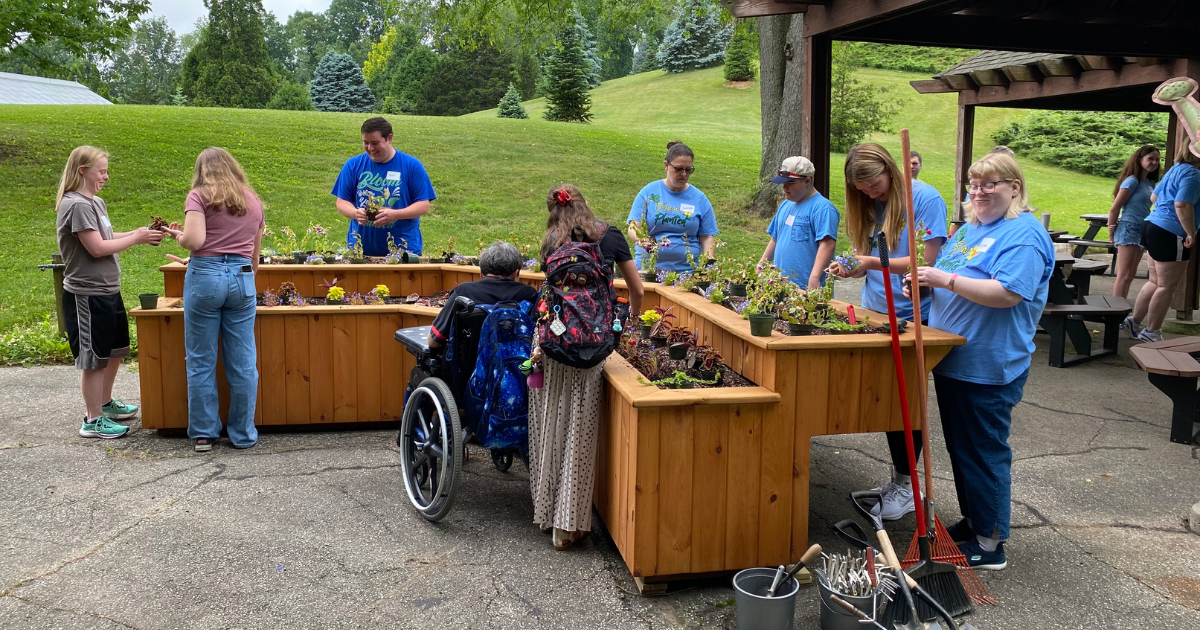 Participants in Project BLOOM work on their plants.