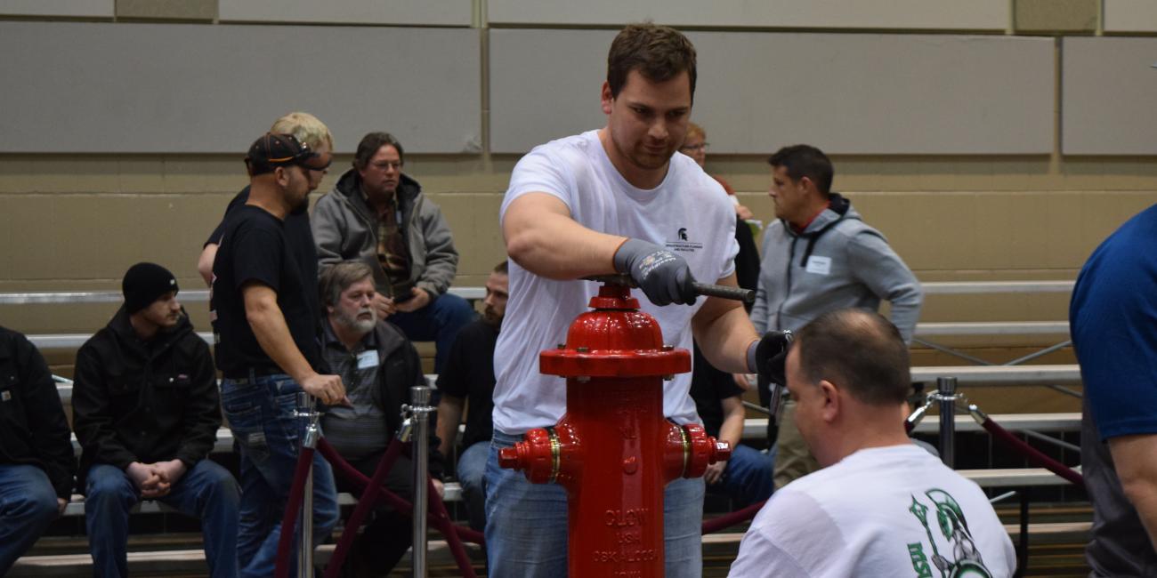 IPF employees configure a hydrant.