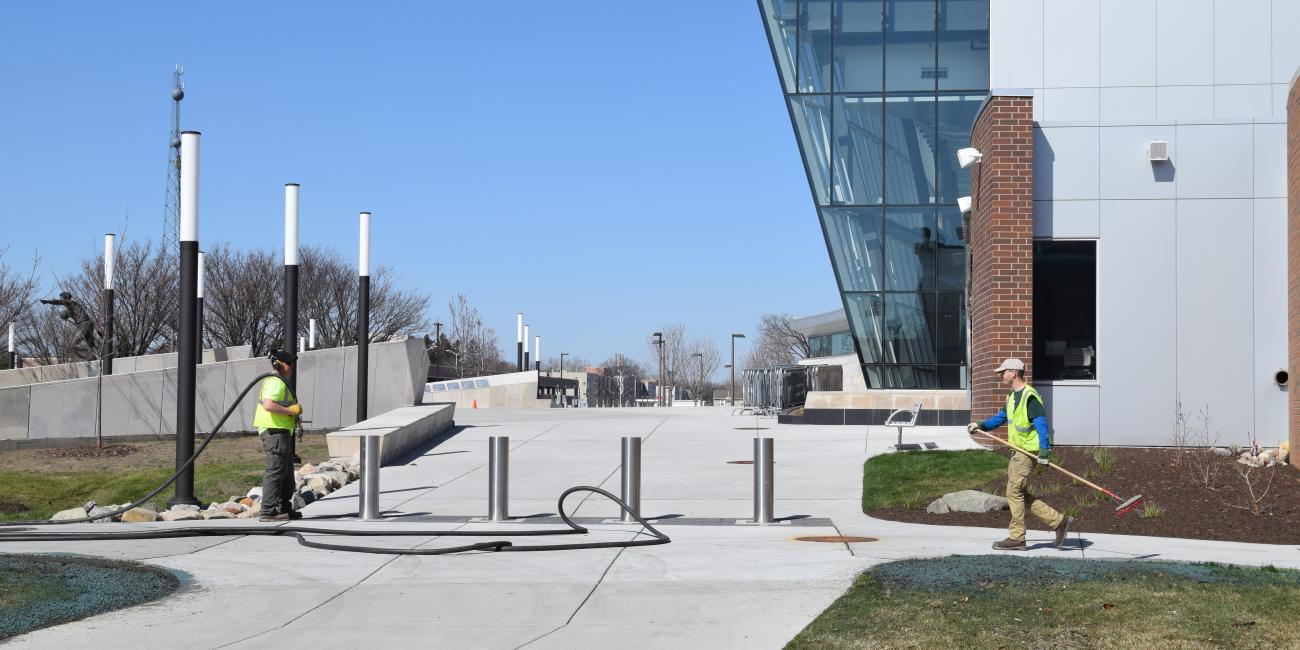 Two landscapers outside of the Breslin Center.