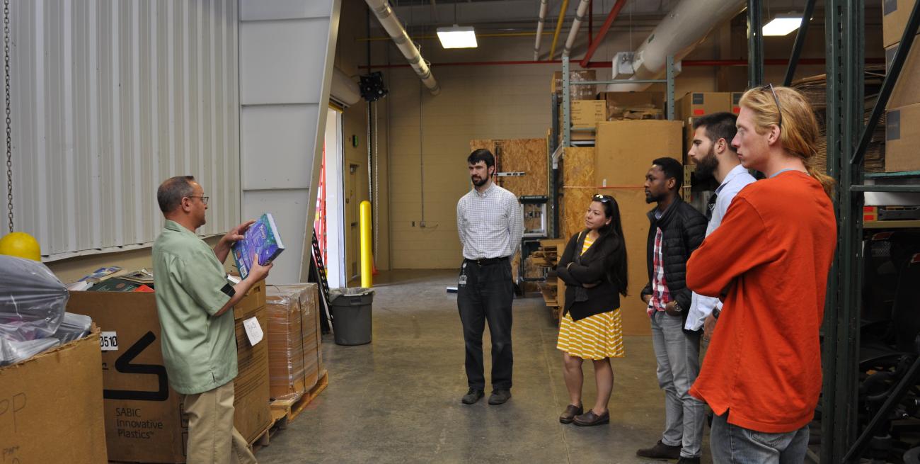 A group tours the MSU Surplus and Recycling Center