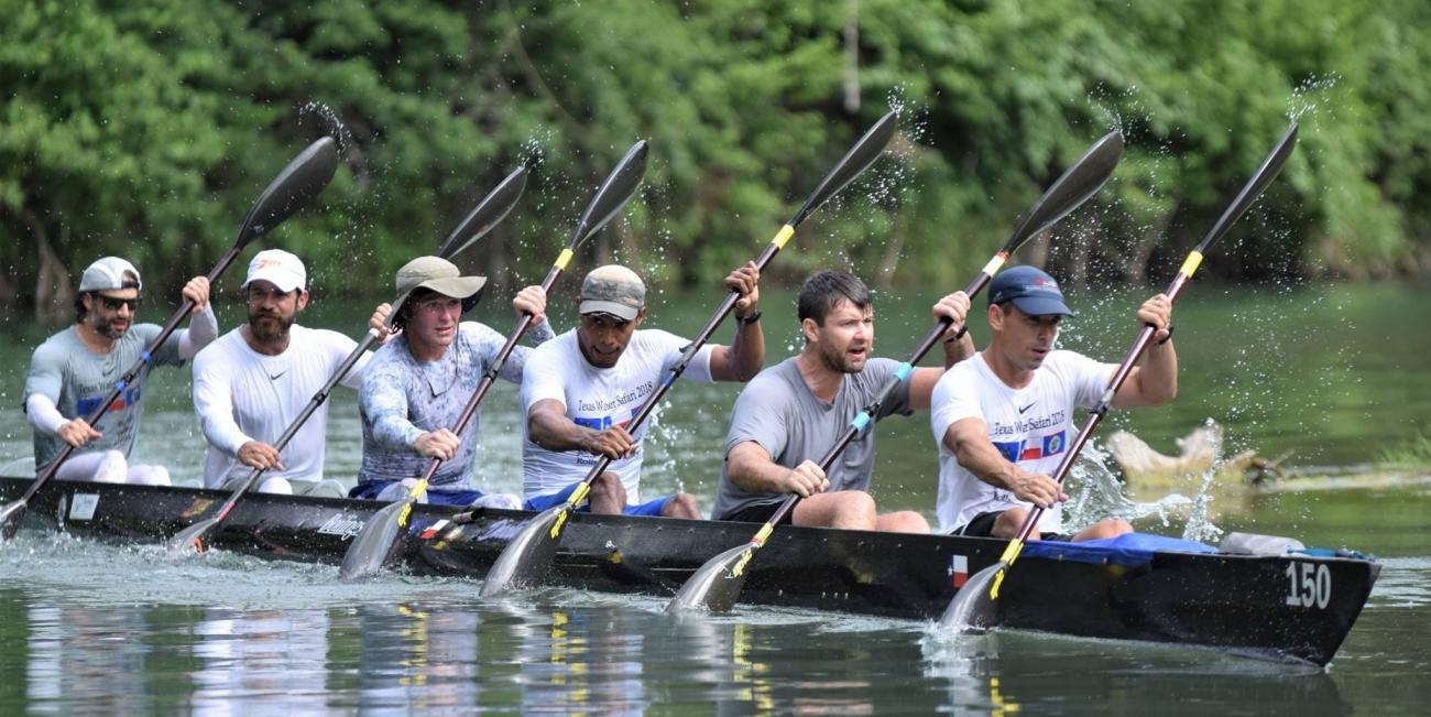 Nick Walton competes with his rowing team