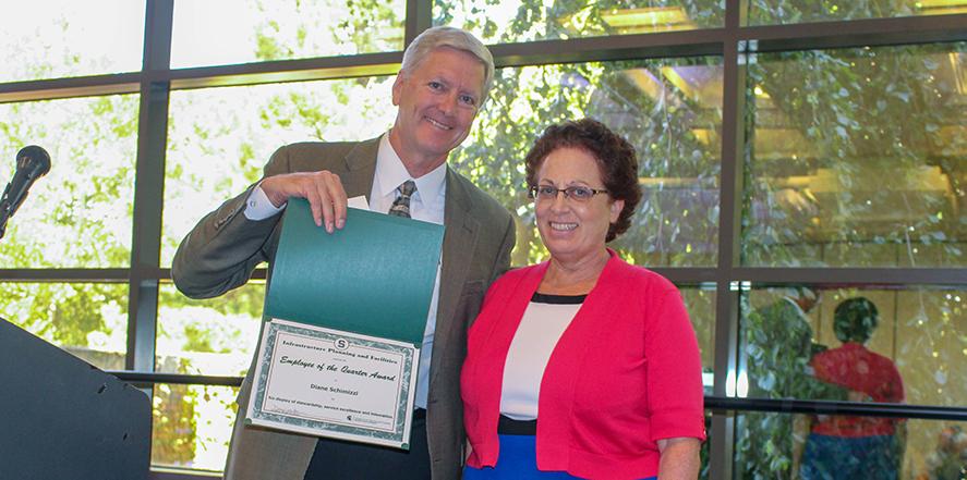 photo of diane schimizzi accepting her award from dan bollman