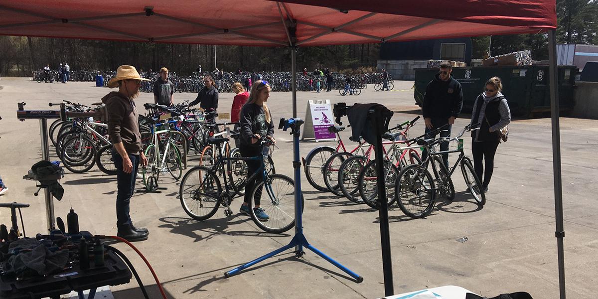 Students purchasing bikes at the surplus store bike sale