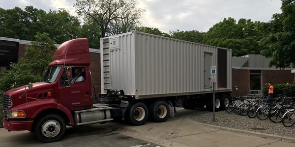 Big Mo flatbed mobile generator pulling up to Owen Hall